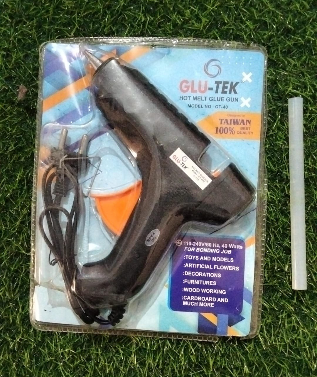 GLU-TEK GT-40 40W Hot Melt Glue Gun in retail packaging with an individual transparent glue stick beside it