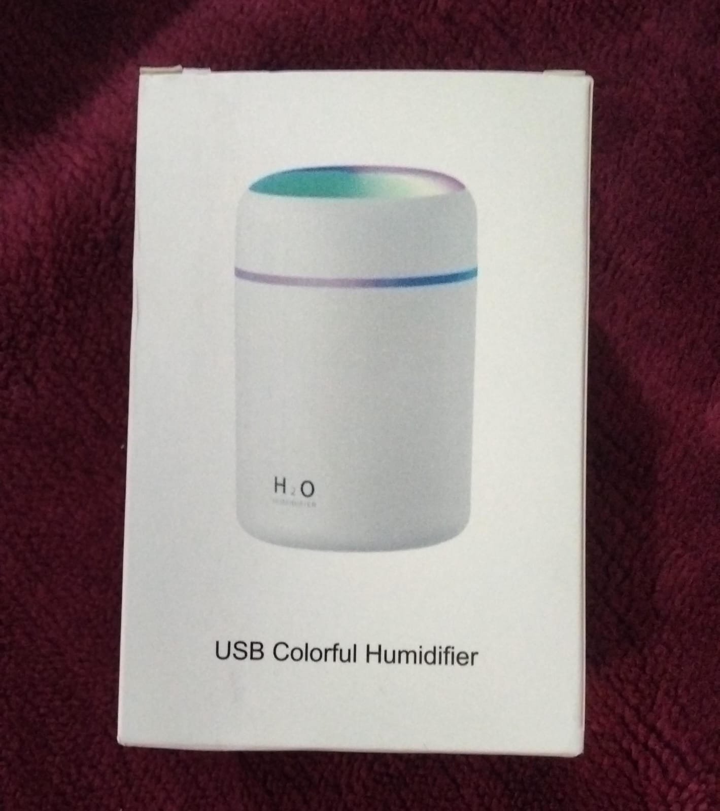 White retail packaging box of H2O USB Colorful Humidifier showing the mini cylindrical air humidifier device with a glowing gradient top