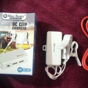 Blue Beatz DC-037 3.4A DC Clip Charger with its retail packaging box showing a tractor, featuring alligator clips and dual USB ports
