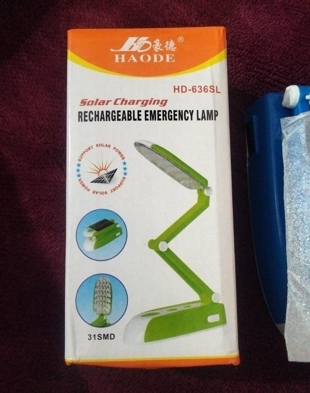 HAODE HD-636SL solar charging rechargeable emergency lamp retail packaging box showing a green foldable 31 SMD LED desk light
